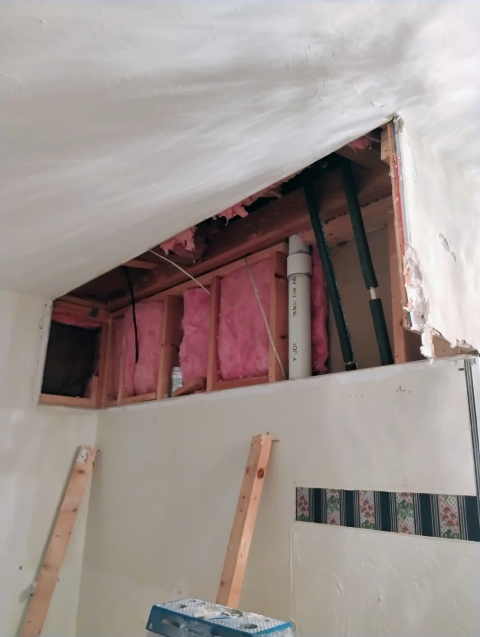 Water-damaged ceiling opened at the source in a Sarasota home