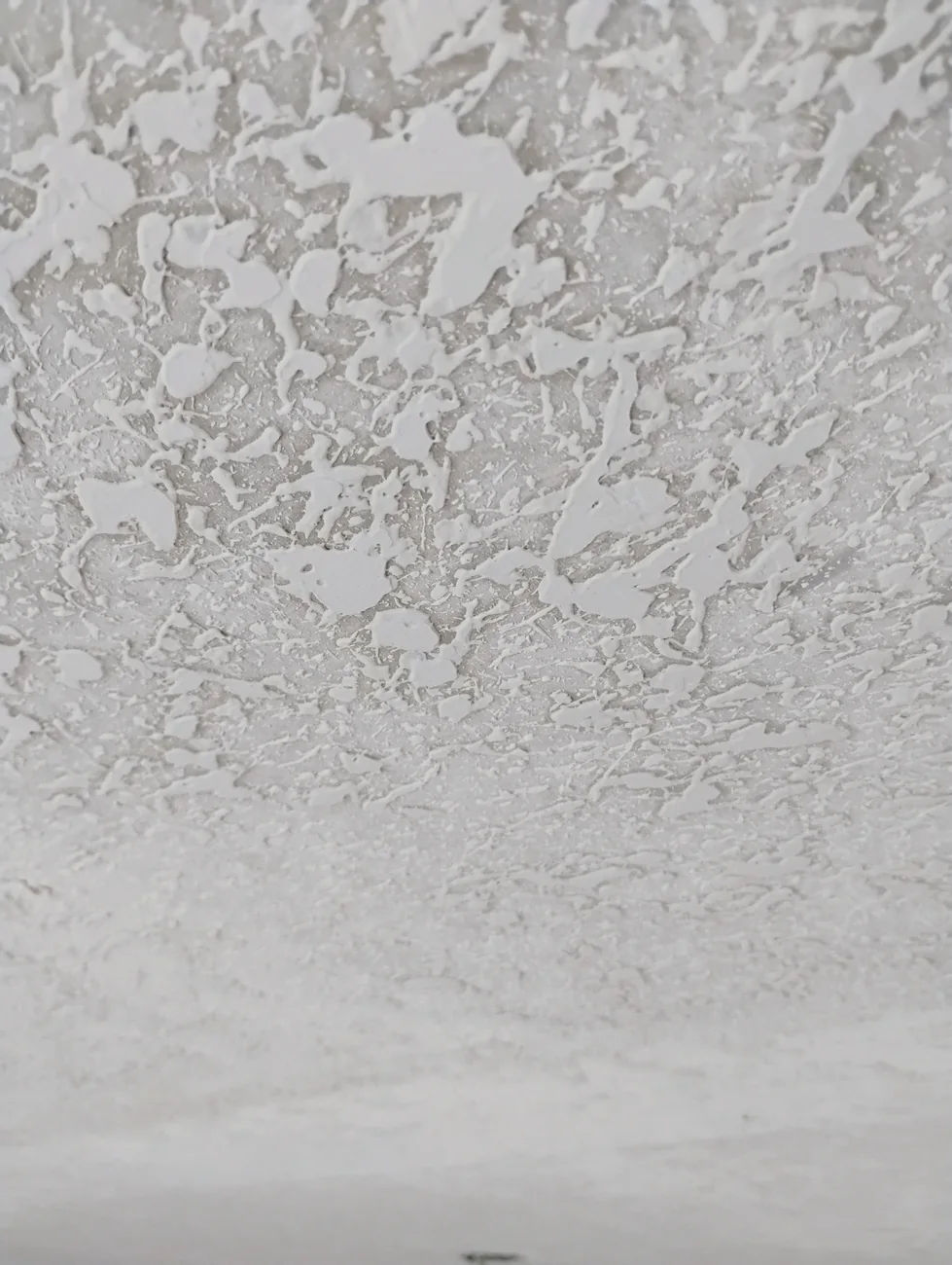 Water-damaged ceiling texture matched and refinished in a Sarasota home