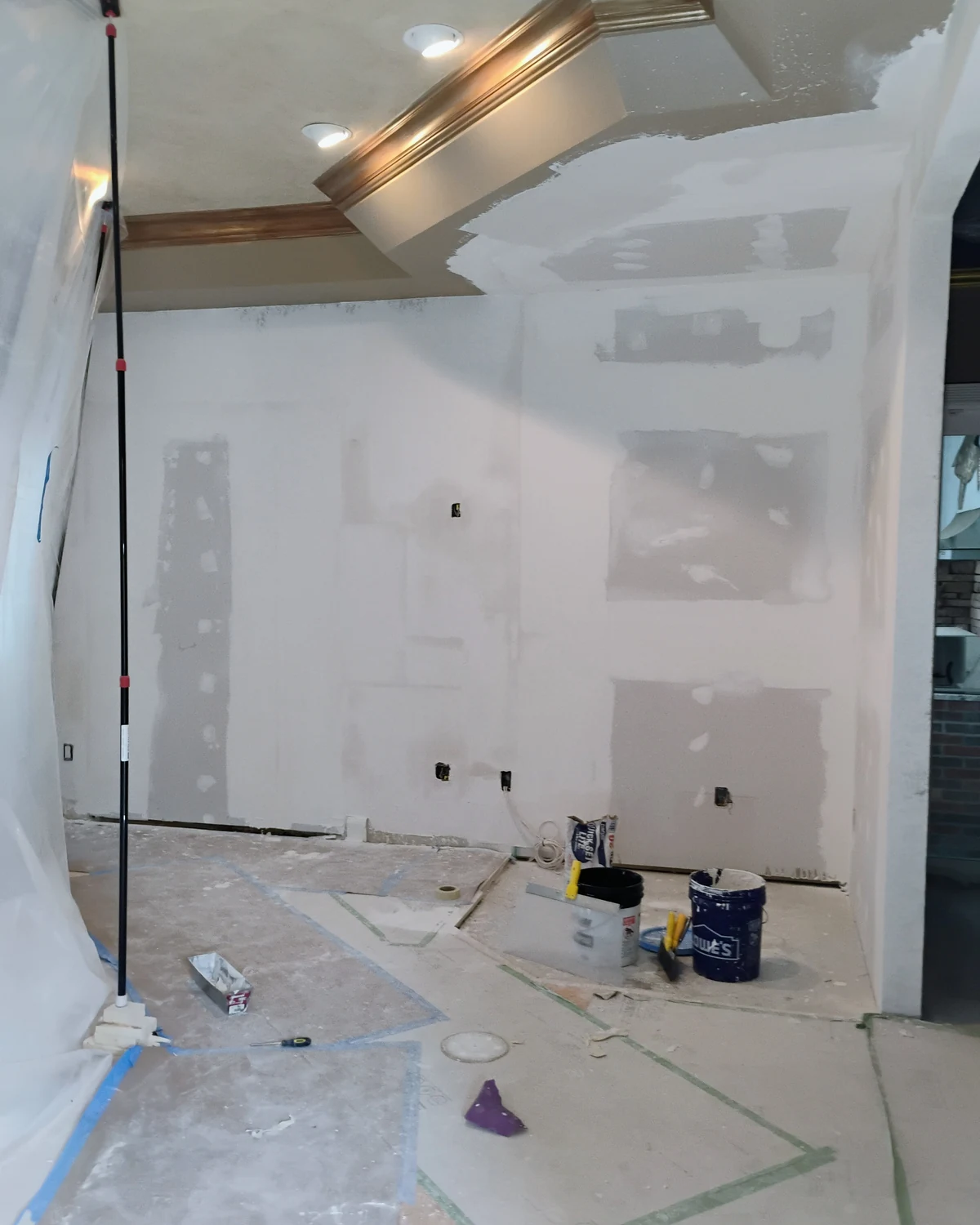 Level 5 drywall finishing in progress in a Sarasota, FL home